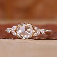 A detailed shot of a lab grown round diamond set in a rose cut diamond ring. Rose Cut Engagement Ring, Rose Cut Engagement Rings, Engagement Ring With Side Stones, Ring With Side Stones, Rose Cut Ring, Rose Cut Diamond Ring, Moissanite Vs Diamond, Colored Diamond Rings, Beauty Features