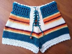 a crocheted shorts is sitting on the floor