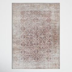 an antique rug is hanging on the wall in front of a white wall and floor