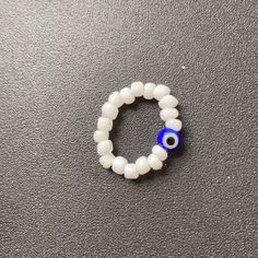 Homemade Beaded Ring Stretchy Blue Rings Beads, Small Bead Rings, White Evil Eye Ring Jewelry, White Evil Eye Ring, Minimalist White Beaded Rings, White Beaded Rings, Seed Bead Rings, Bead Rings, Bracelet Inspo