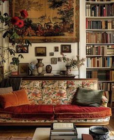 a living room filled with lots of books and furniture