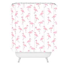 a shower curtain with pink flamingos on it