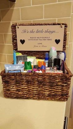 a basket filled with personal care items sitting on top of a counter next to a sign