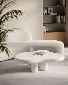 a white couch and table in a room