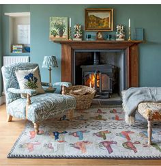 a living room filled with furniture and a fire place next to a painting on the wall