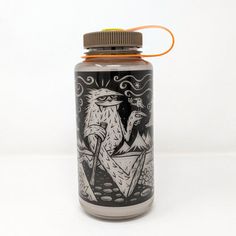 a bottle with an eagle on it sitting on a white surface