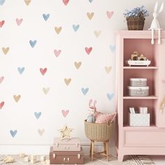 a child's room with hearts painted on the wall