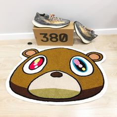 a brown bear rug on the floor next to shoes and a cardboard box with 350 written on it