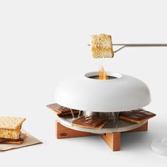 a toaster that is on top of a plate with some crackers in it