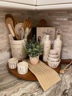 kitchen utensils are arranged on a counter top