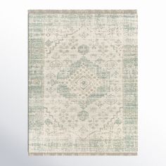 an area rug with green and white colors