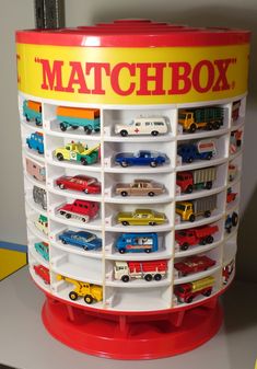 the matchbox display is filled with toy cars and trucks for children's play