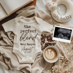 a baby's bodysuit with the words, the perfect blend and coffee on it