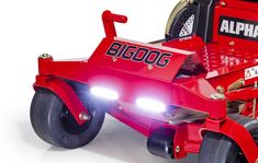 a red lawn mower with lights on it's front wheels and the words, bigdog