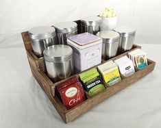 an assortment of teas and coffee on a tray