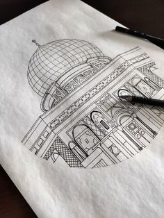 a black pen is sitting on top of a piece of paper with a drawing of a building