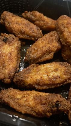 fried chicken wings in a frying pan ready to be cooked