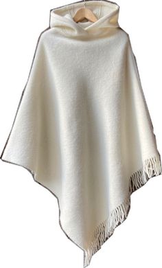 White Winter Poncho Cape, White Cozy Winter Poncho, Oversized Fringe Cape For Winter, Oversized White Cape Poncho, White Oversized Winter Cape, Oversized White Poncho Cape, White Oversized Winter Poncho, Oversized White Poncho For Winter, Winter Shawl Cape With Fringe