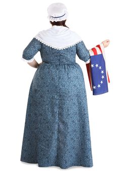 a woman in a blue dress and hat holding an american flag