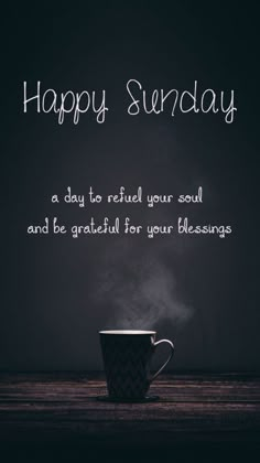 a coffee cup with steam coming out of it and the words happy sunday written in white