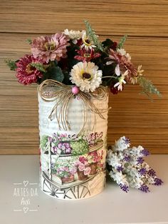 a vase with flowers sitting on top of a table