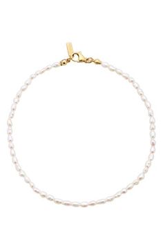 Accessorize with the timeless sophistication of this single-strand anklet showcasing a stream of lustrous freshwater pearls. 10 1/2" length Lobster clasp closure Pearl size: 2mm Freshwater pearl/18k-gold plate Imported Small Pearl Bracelet, Proposal Outfit, Anna Aesthetic, Pjo Oc, Dainty Pearl Bracelet, Pearl Jewlery, Hoco 2024, Pearl Anklet, Digital Closet