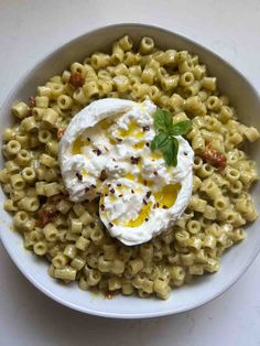 a white bowl filled with macaroni and cheese