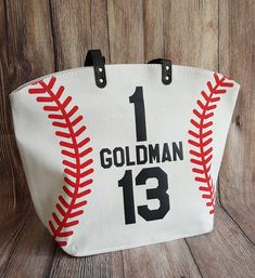 "Personalized Baseball Mom Tote Bags White Baseball Bag Tote Bag Spirit Wear Custom Last Name Nickname Number This listing is for a white baseball tote bag custom heat printed with your, your significant other, or your child's nickname, last name and/or jersey number. Please leave a note with your request for what you would like the bag to read in the \"message to seller\" box at checkout or contact me through Etsy's conversations feature. If you would like a color shown on the color chart but n Baseball Bags, Baseball Tote Bag, Cricut Baseball, Mom Tote Bag, Baseball Bag, Tote Bag Custom, Personalized Baseballs, Team Mom, Player One