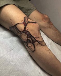 a man with a tattoo on his leg