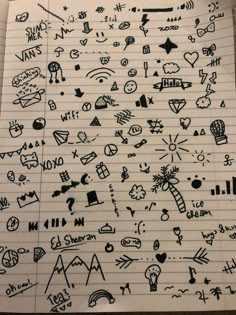 an open notebook with doodles and drawings on it