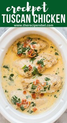 a white bowl filled with chicken and spinach