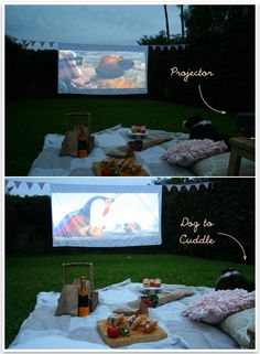 a movie screen is set up in the backyard with food and drinks on it,