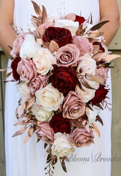 a bride holding a bouquet of flowers in her hands