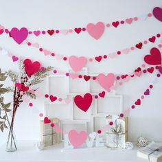 valentine's day decorations with pink and red paper hearts