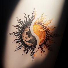 a sun and moon tattoo on the side of a white wall