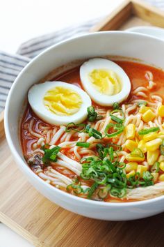 a bowl of ramen with hard boiled eggs on top