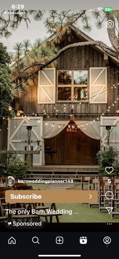 an image of a barn with lights on it