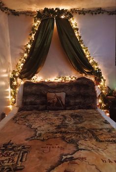 a bed with lights on the headboard and curtains over it's head board