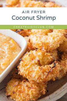 air fryer coconut shrimp on a plate with dipping sauce