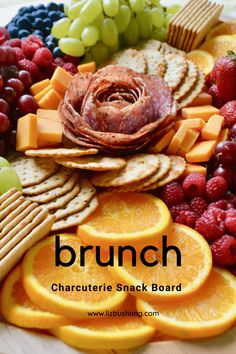 an assortment of cheeses, crackers and fruit on a platter with the words brunch