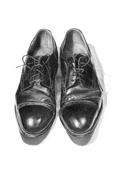 a black and white drawing of a pair of shoes