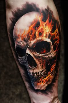 a man's arm with a skull and flames on it