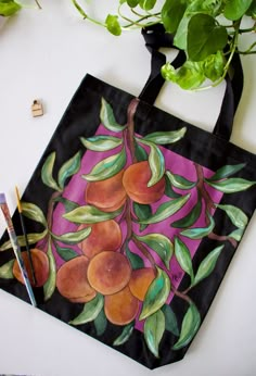 "~Hand painted reusable canvas tote bag with an original peach tree handpainted design on front!  ~This tote has a pocket for small items such as phones, keys, etc ~This is a perfect bag to take to the book store, beach, grocery shopping, or every day use ~Eco friendly and stylish way to carry items ~Hand crafted with care, painted with acrylic paint mixed w/ fabric medium ~Care: Due to the nature of the item it is spot clean, or hand wash only. Please do NOT machine wash bag.  ~Colors may vary Handpainted Totebag, Handpainted Tote, Handpainted Tote Bags, Hand Painted Purses, Fabric Painting Techniques, Peach Tree, Cool Paper Crafts, Painted Tote, Painted Bags