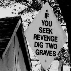 a sign that says if you seek revenge dig two graves