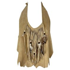 Boho chic 1970s suede leather fringed beaded crop top ! Features ties around the back neck and center back. Side fringe details with feathers. Asymmetrical hem. Very flattering. Pair with jeans, shorts or a skirt. Very well made in USA Marked Size Medium Measurements: 34 inch bust 24-34 inch waist ( adjsutable ) 70s Halter, Beaded Crop Top, Viking Dress, Side Fringe, Character Clothing, Dark Arts, Concept Clothing, Western Chic, Brown Outfit