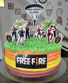 there is a cake that has been decorated with people in costumes on top of it