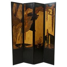 a room divider with paintings on it