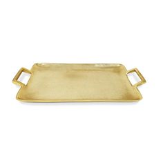 a gold tray with two handles on the front and one in the middle, sitting on a white surface