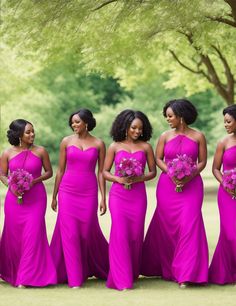 a group of women in pink dresses standing next to each other