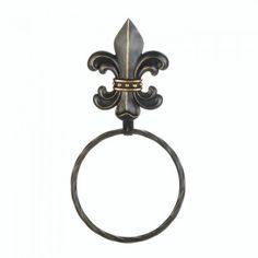 an antique style towel ring with fleur de lis on the front and center